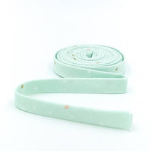 Load image into Gallery viewer, Double Fold Bias Tape 1/2'' Spin & Twirl Stars Mist Mint Green Sparkle Gold Bias Binding