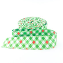 Load image into Gallery viewer, Quilt Binding Jingle Bells Plaid Gingham Green Red 1 1/4&quot; Wide Single Fold
